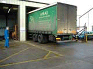 Commercial vehicle entering workshop